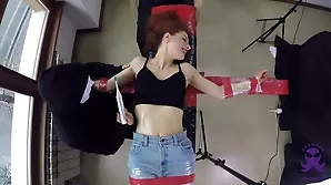 Red-haired Giulia’s octopus-like dance routine includes bondage and tickling.