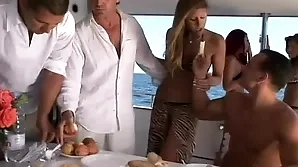 A beautiful blonde gets a rough gang bang on a yacht in the middle of the sea.